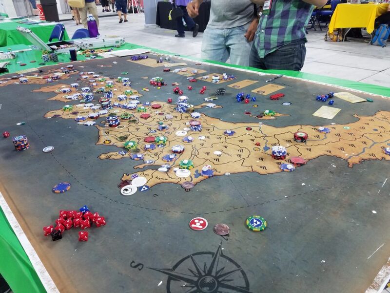 Megagame event with players gathered around tables