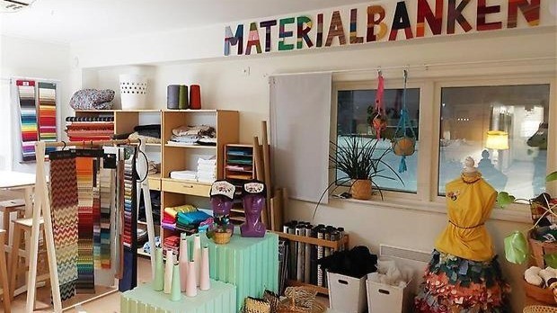 Interior of Materialbanken showing shelves of colorful reused materials and craft supplies